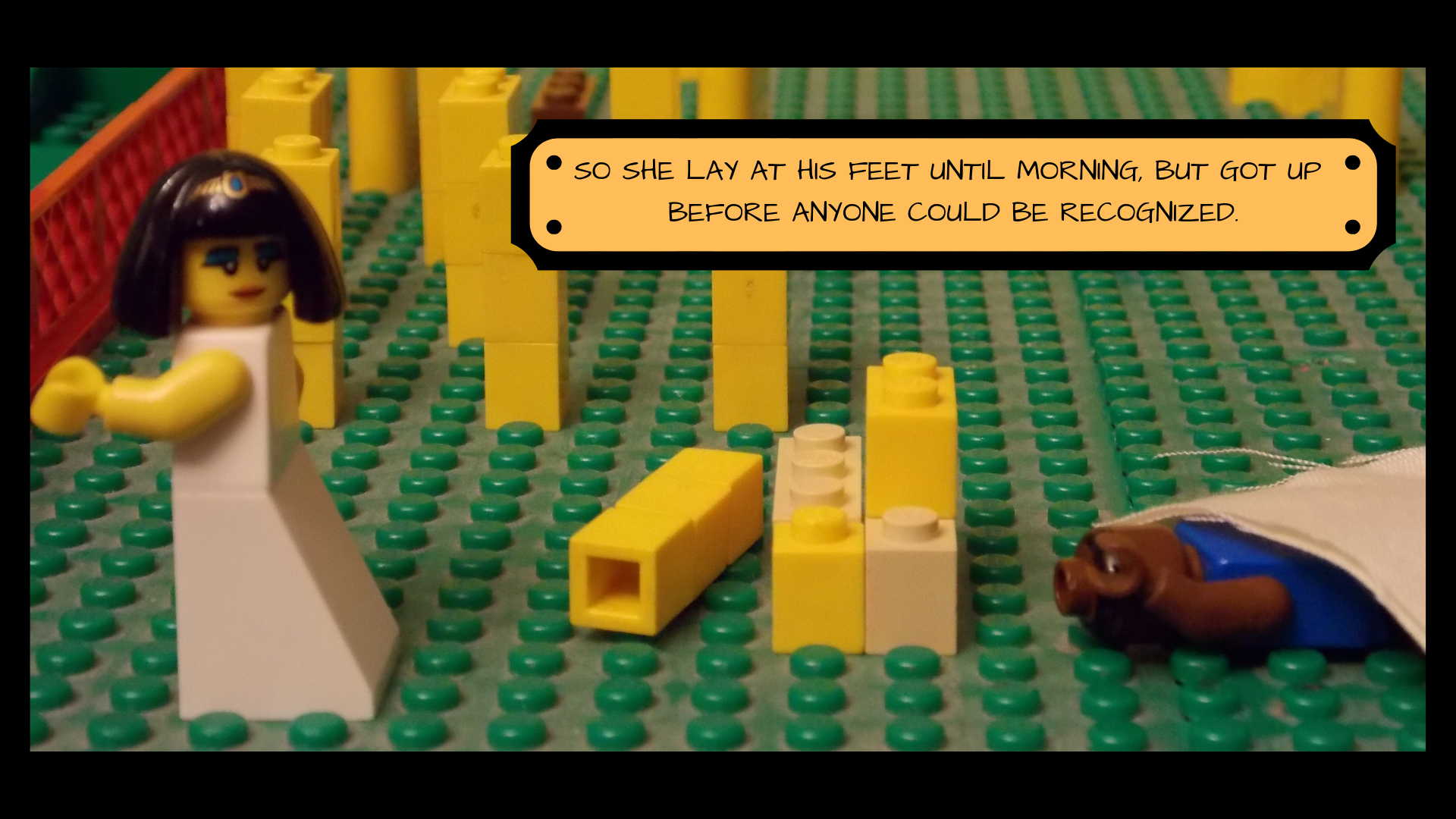 While Lego Boaz is still sprawled out under the blanket, Ruth sneaks away, looking over her shoulder at Boaz. The text reads, "So she lay at his feet until morning, but got up before anyone could be recognized."
