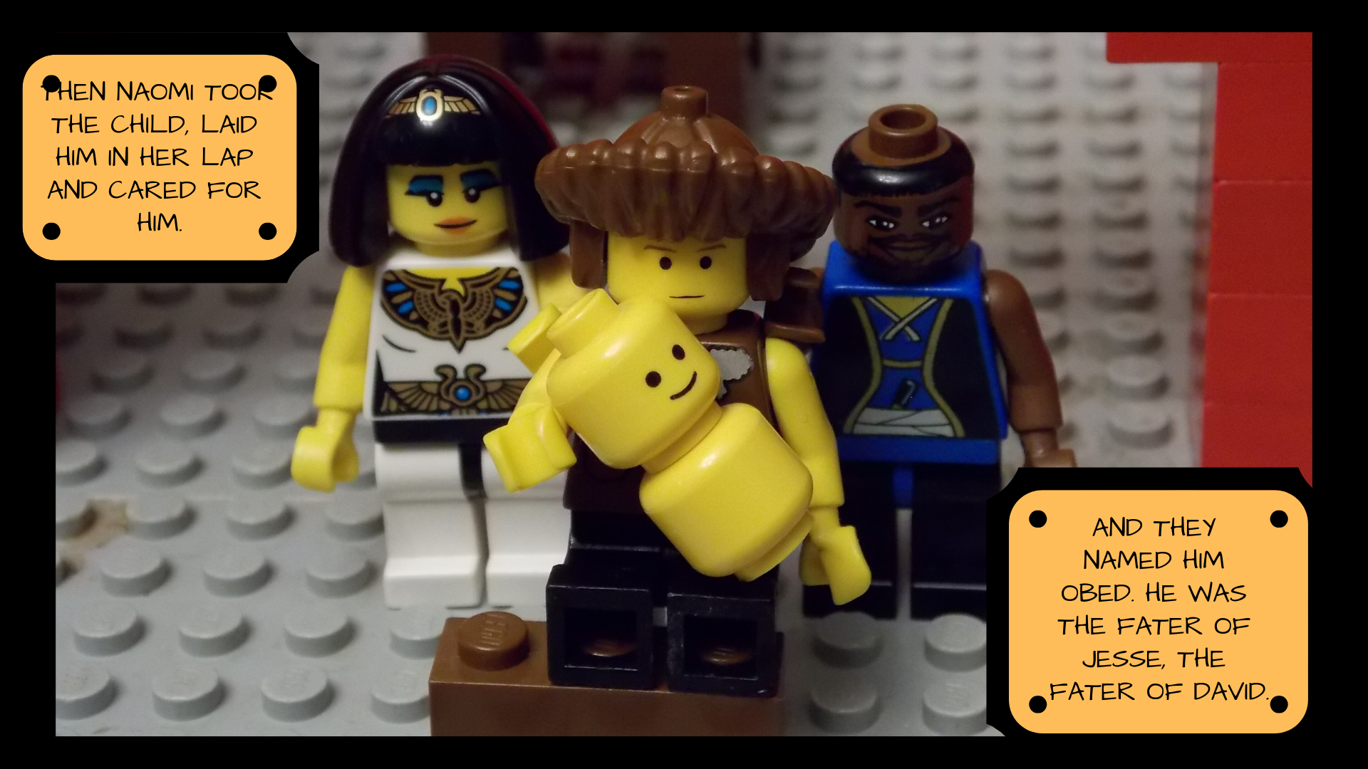 Lego Naomi holds the Lego baby while Ruth and Boaz stand on either side of her. The text reads, "Then Naomi took the child, laid him in her lap and cared for him. And they named him Obed. He was the father of Jesse, the father of David."
